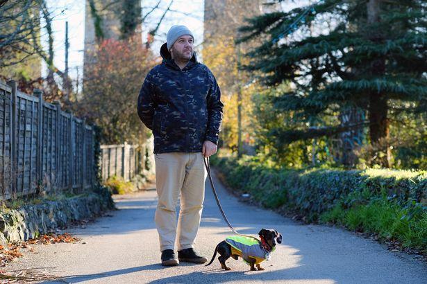 Angarrack resident Dan Amos taking his dog Ziggy for walk in the village (Image: Greg Martin / Cornwall Live) 